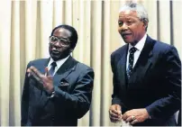  ?? Picture: Jon Hrusa ?? Robert Mugabe and then president Nelson Mandela at the Union Buildings in 1995. Mandela could not stand him.