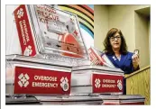  ?? CHRIS
STEWART / STAFF
/ FILE ?? Barbara Marsh, Public Health
—Dayton & Montgomery County’s assistant
health commission­er, is pictured with opioid rescue kits containing naloxone.