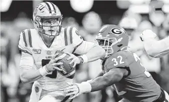  ?? Kevin C. Cox / Getty Images ?? Georgia couldn’t keep up with LSU quaterback Joe Burrow, who passed for 349 yards and four touchdowns. He was also the Tigers’ second-leading rusher with 41 yards on 11 carries.