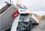  ?? KEVIN SPEAR/STAFF ?? Hurricane Irma flattened the roof over the pumps at Goma Peace Food Store gas station on Tampa Avenue.