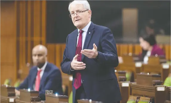  ??  ?? Minister of Transport Marc Garneau addresses a recent emergency sitting of Parliament regarding COVID-19. Very few MPs were required to be present.