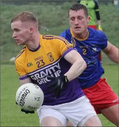  ??  ?? Pierce Dooley of St. Mary’s is watched closely by Aidan Jones.