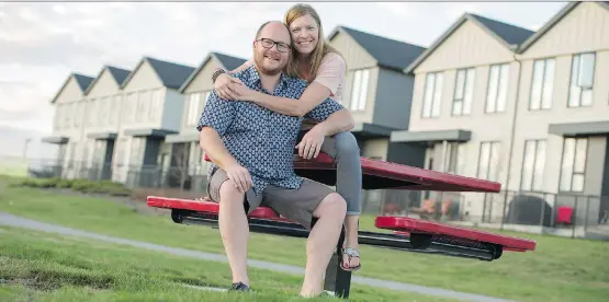  ?? DON MOLYNEAUX ?? For Kyle Girard and Marni Hutchinson, easy access to green space and pathways is part of the appeal of their new townhome at Arrive at the Landing in Okotoks.