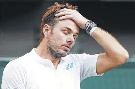  ?? Adrian Dennis / AFP/Getty Images ?? Stan Wawrinka, bidding for a Wimbledon title to complete the career Grand Slam, was dismayed by a four-set loss to Daniil Medvedev.