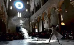  ??  ?? TOP: The embalmed remains of Saint Columba in the crypt of the Cathedral of San Sabino. ABOVE CENTRE: A southern Italian Mothman in Bari’s castle? ABOVE: Midsummer rites at the Cathedral of San Sabino.