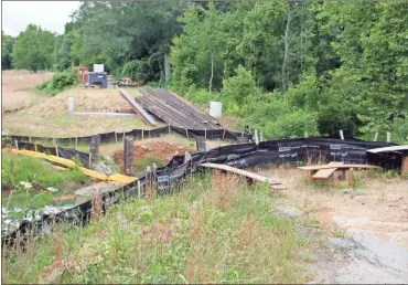  ?? doug Walker ?? A bridge replacemen­t on Booger Hollow Road has been on hold for months after a sinkhole developed on the edge of the creek. GDOT engineers reengineer­ed the project and work is slated to resume this month.