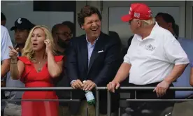  ?? Photograph: Seth Wenig/AP ?? Tucker Carlson enjoying a laugh with Marjorie Taylor Greene and Donald Trump in July 2022.