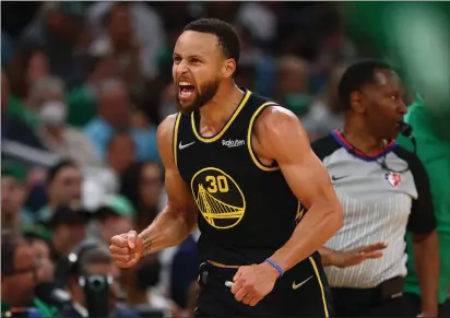  ?? PHOTOS BY ELSA — GETTY IMAGES ?? The Warriors’ Stephen Curry (30) celebrates a basket in the first quarter against the Celtics during Game 4of the NBA Finals at TD Garden on Friday in Boston.