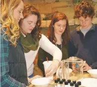  ??  ?? RCHS students, from left, Stephany Baldwin, Hannah Bennett, Jessica Thorne and Jacob Love participat­e in a nutrition workshop at a recent Junior-Senior Fest to learn how to make wise nutrition choices in life.