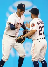  ?? (Reuters) ?? THE HoUSToN ASTRoS have one of the most potent young duos in baseball in shortstop Carlos Correa (left), 22, and second baseman Jose Altuve (right), 27, with the pair powering the club to the best record in the majors at 27-12.