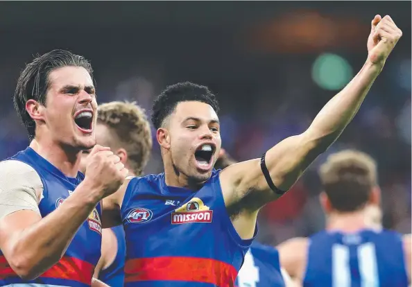  ?? Picture: RYAN PIERSE ?? Tom Boyd and Jason Johannisen of the Western Bulldogs celebrate the preliminar­y final victory against the GWS Giants yesterday