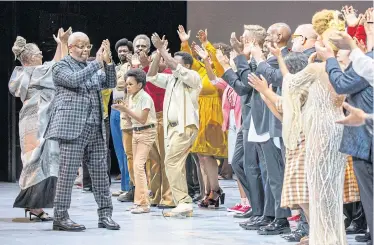  ?? ?? The composer Terence Blanchard, second from left, applauds the cast and staff during the final curtain call of ‘Fire Shut Up in My Bones’.