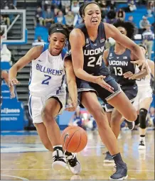 ?? JEFF ROBERSON/AP PHOTO ?? UConn’s Napheesa Collier (24) and Saint Louis’ Ciaja Harbison (2) collide as they chase after a loose ball during the No. 1 Huskies’ 9842 on Tuesday night in St. Louis.