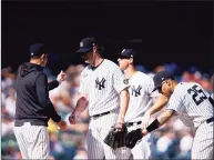  ?? Eduardo Munoz Alvarez / Associated Press ?? New York Yankees starting pitcher Gerrit Cole, center, is relieved in the sixth inning against the Cleveland Indians on Sunday in New York.