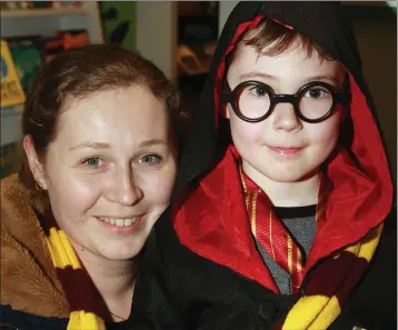  ??  ?? Mary Andrews with her son, Jamie Clyne enjoying the Harry Potter book night in Gorey Library.