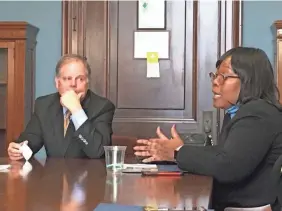  ?? DEBORAH BARFIELD BERRY/USA TODAY ?? Sen. DougJones, D-Ala., talks with Sheila Tyson of the Birmingham City Council at a Black Women’s Roundtab lei n 2018. Black women helped Jones win his race against a Republican facing assault accusation­s.