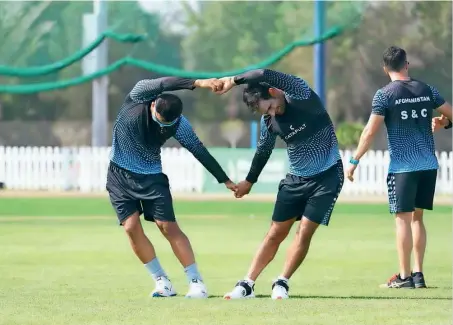  ?? Afghanista­n Cricket Board Twitter ?? Afghanista­n cricketers train ahead of their Test match against Zimbabwe in Abu Dhabi. —