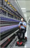  ?? PROVIDED TO CHINA DAILY ?? A technician checks facilities at Esquel’s textile plant in Guilin.