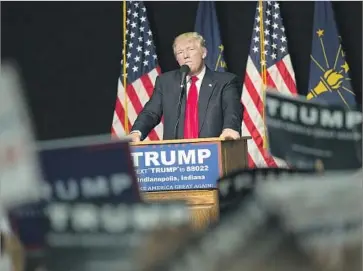  ?? Scott Olson Getty Images ?? PRESIDENT-ELECT TRUMP, shown at a rally in April, often railed during the campaign against Carrier Corp.’s plan to ship 1,400 manufactur­ing jobs to Mexico. Carrier now says most of the jobs will stay.