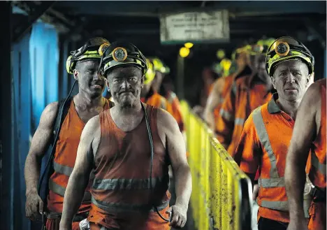  ?? NIGEL RODDIS/AFP/GETTY IMAGES ?? Coal miners finish the final shift before closure at the Kellingley Colliery in Yorkshire, northern England, on Friday. The shutdown of the mine closes a 200-year chapter of Britain’s industrial history. Full story on page B4.