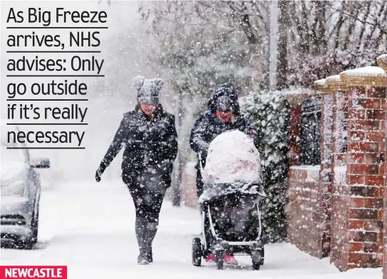  ??  ?? Making tracks: Two women ‘brave’ the snow that blanketed the North East, which prompted NHS England North’s warning NEWCASTLE