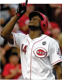  ?? DAVID JABLONSKI PHOTOS / STAFF ?? Aristides Aquino celebrates a home run against the Angels on Tuesday at Great American Ball Park. The former Dayton Dragon has replaced Yasiel Puig in right field.