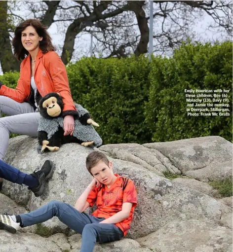  ??  ?? Emily Hourican with her three children, Bee (6) , Malachy (13), Davy (9), and Jamie the monkey, in Deerpark, Stillorgan. Photo: Frank Mc Grath