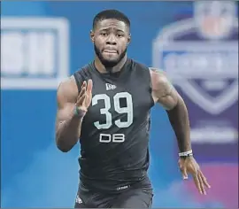  ?? Charlie Neibergall Associated Press ?? TERRELL BURGESS, shown at the NFL combine, was a hybrid player at Utah. “This guy played everywhere,” Rams defensive coordinato­r Brandon Staley said.