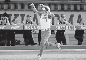  ?? [PHOTO BY SARAH PHIPPS, THE OKLAHOMAN] ?? Oklahoma’s Nicole Pendley celebrates her home run in the seventh inning Sunday in a 7-0 regional-clinching victory over Missouri in Norman.