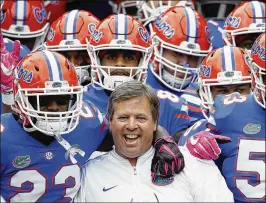  ?? JOE ROBBINS / GETTY IMAGES ?? Florida players know they have to move on from the departure of former coach Jim McElwain as they hope to end a four-game losing streak.