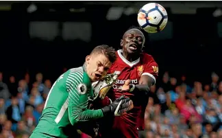 ?? LEE SMITH ?? Liverpool’s Sadio Mane’s foot catches Manchester City keeper Ederson Moraes during the Premier League match.