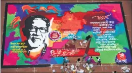  ??  ?? Artists work on a 50ft by 30 ft rangoli of Late Balasaheb Thackeray for his birth anniversar­y on January 23, at Lalbaug.
