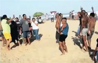  ?? PICTURE: FACEBOOK ?? Confrontat­ion on the beach as two families face off on the sand.