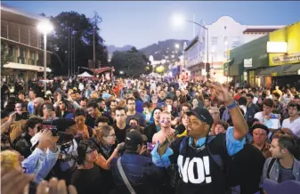  ?? Photos by Noah Berger / Special to The Chronicle ?? Several hundred protesters rally peacefully on Bancroft Way as the Daily Wire Editor in Chief Ben Shapiro spoke inside Zellerbach Hall with tight security, including metal detectors.