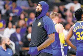  ?? Santiago Mejia / The Chronicle ?? Center DeMarcus Cousins, seen during a preseason game at San Jose’s SAP Center, got his first statistic in a regular-season box score with the Warriors when he was ejected in New York.