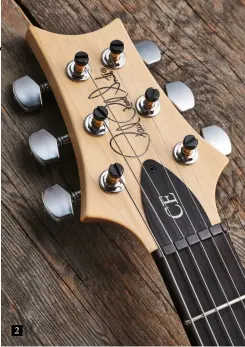  ??  ?? Hardware here is the same you’ll see on PRS’s USA S2 models; excellent top-lock tuners with unplated posts and a frictionre­ducing nut all form part of a very in-tune vibrato system