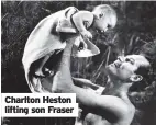  ??  ?? Charlton Heston lifting son Fraser