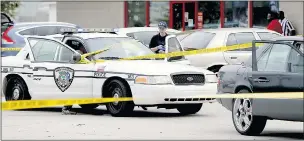  ??  ?? Police seal off Slager’s patrol car and victim Walter Scott’s Mercedes, right
