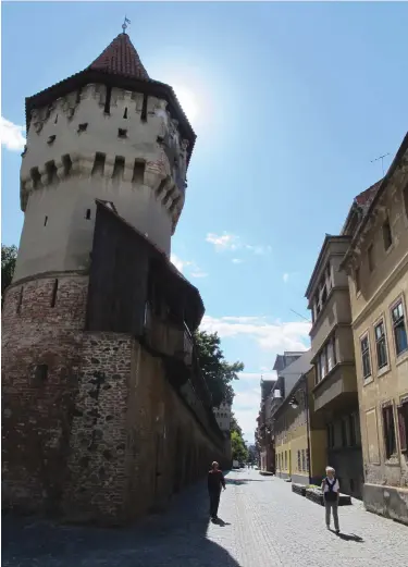  ?? (John Dowling/Chicago Tribune/TNS) ?? ROMANIA WAS a battlegrou­nd for centuries, and the massive walls that protected inhabitant­s still survive in cities such as Sibiu, in Transylvan­ia. Each of the city’s trade guilds was responsibl­e for the upkeep of a section of the city walls.