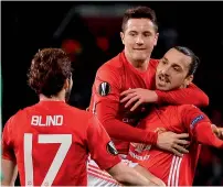  ?? — AFP ?? Manchester United’s Zlatan Ibrahimovi­c (right) celebrates scoring his team’s first goal.