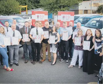  ??  ?? Volunteer of the Year winners with their certificat­es and, left, Graeme Holloway with Katy Daley-Mclean.