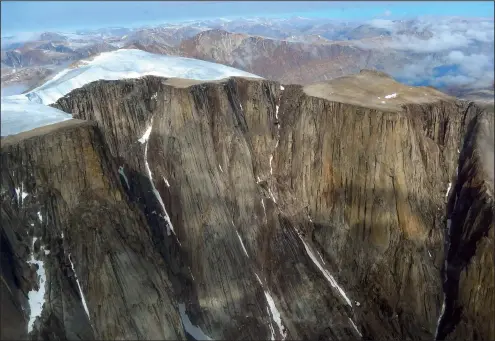  ?? Gifford Miller, University of Colorado Boulder/INSTAAR ?? Glaciers and ice caps on Baffin Island in Arctic Canada have been retreating rapidly in recent decades. Dead moss collected at the margin this ice cap was dated by radiocarbo­n to have been killed more than 48,000 years ago.