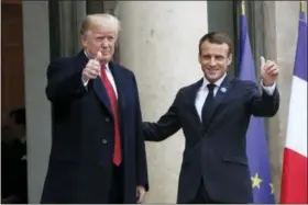  ?? THIBAULT CAMUS — THE ASSOCIATED PRESS ?? French President Emmanuel Macron, right, and U.S President Donald Trump thumb up at the Elysee Palace in Paris, Saturday, Nov.10, 2018. Trump is joining other world leaders at centennial commemorat­ions in Paris this weekend to mark the end of World War I.