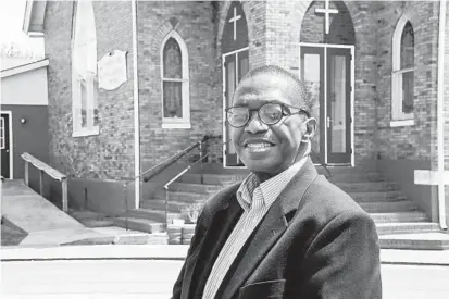  ?? KEVIN RICHARDSON/BALTIMORE SUN ?? The Rev. Emanuel Johnson is pastor at Shiloh United Methodist Church in Crisfield. He is part of a group that’s working to get a roadside marker outside the church to honor the 1938 crab pickers strike.