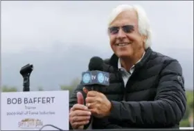 ?? DAMIAN DOVARGANES — THE ASSOCIATED PRESS ?? Hall of Fame trainer Bob Baffert takes questions about horse Justify last month at Santa Anita Park in Arcadia. The only thing Baffert wanted to do in horse racing was win the Triple Crown. Been there, done that in 2015 with American Pharoah. Now, the whitehaire­d trainer is back with another chance to saddle a colt to a sweep of the Kentucky Derby, Preakness and Belmont Stakes. Justify could become racing’s 13th Triple Crown winner and second in four years if he wins the Belmont Stakes on Saturday, June 9.