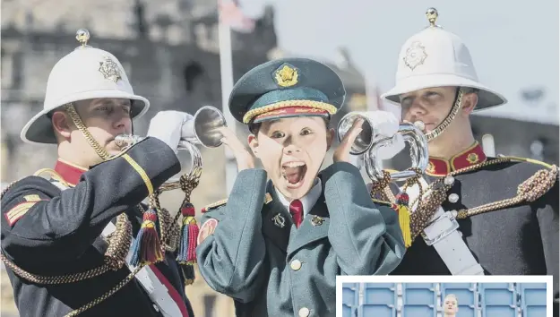  ??  ?? 0 Sergeant Ayami Nakama of the Japanese self-defence force band is deafened by Nathan Crossley and Jason Morris of the Royal Marine Band while her fellow band member Michiko Matsunaga joins Scottish Highland dancer Charlotte Mcfie for the Tattoo...