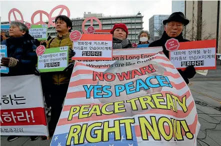  ?? AP ?? Protesters hold a rally near the US embassy in Seoul this week, demanding peace on the Korean Peninsula. The White House says US President Donald Trump will hold a second summit with North Korean leader Kim Jong Un to try to broker a deal to coax the North to give up its nuclear weapons