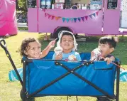  ?? Pictures: STEVE HOLLAND ?? Carole Gray, Philomena Matthews, Renae Heremaia celebratin­g Waitangi Day and (right) Ivy Campbell, Izrael Murtas and Antonio Murtas enjoy the cool treats.