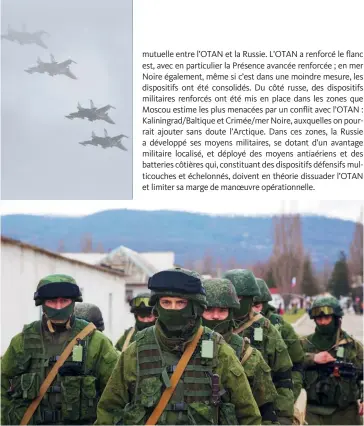  ??  ?? Photo ci-dessus :
La base militaire de Perevalne durant la crise de Crimée, le 28 février 2014. Menée par les prétendus « petits hommes verts »
— en réalité, des troupes d’élite russes déployées sans identifica­tion, changeant la nature juridico-politique du conflit —, l’annexion de la Crimée par la Russie, puis le rôle actif de Moscou auprès des séparatist­es du Donbass, auront marqué un double tournant pour les relations Russie-OTAN : politique, en faisant basculer ces rapports dans le non-dialogue actuel ; militaire, en favorisant la remontée en puissance des armées des États-membres face à la possibilit­é de nouveau envisageab­le d’un conflit majeur. (© photo.ua/ Shuttersto­ck)