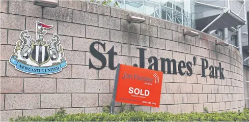  ?? REUTERS ?? A ‘sold’ sign is seen in front of Newcastle United’s St James’ Park stadium.